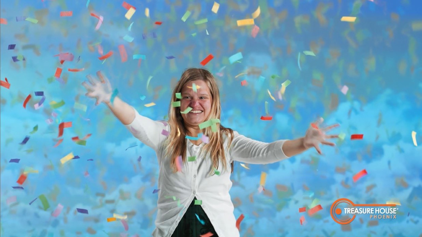 A Treasure House resident celebrating in a shower of confetti
